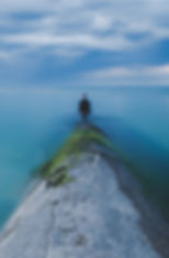Man standing by the Ocean