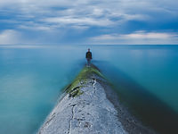 Man standing by the Ocean