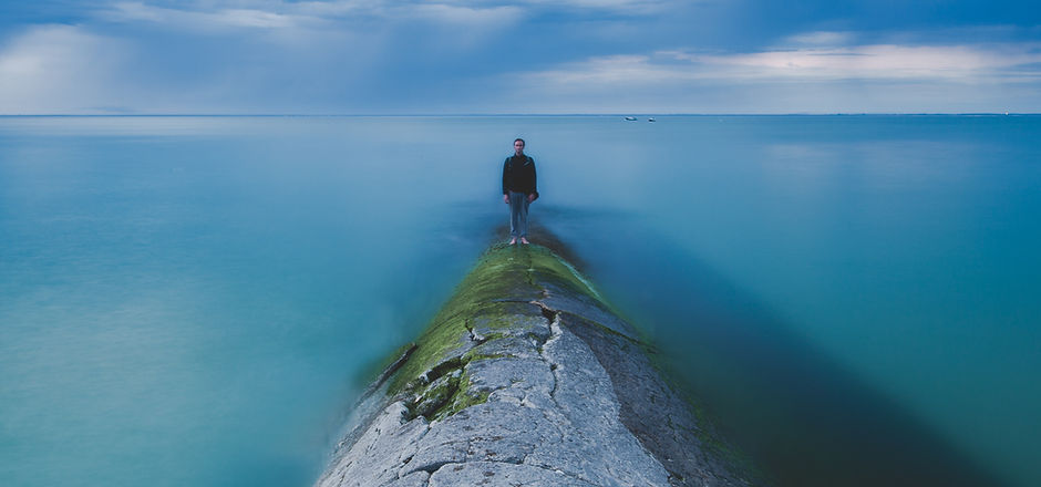 Man standing by the Ocean