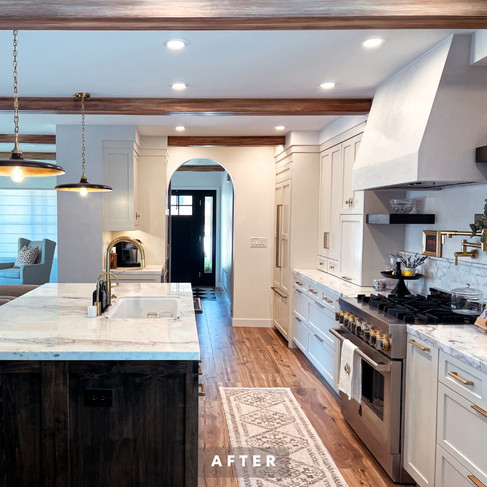 After photo of a San Diego kitchen remodel with white cabinets, updated countertops, improved lighting, and an open floor plan.