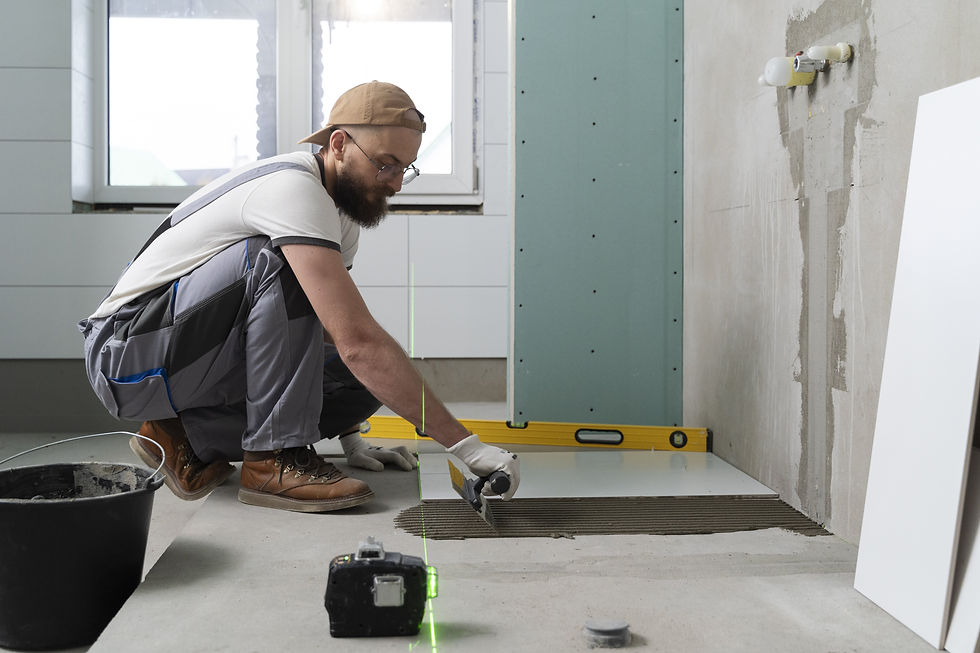 tiler installing tile into a bathroom remodel