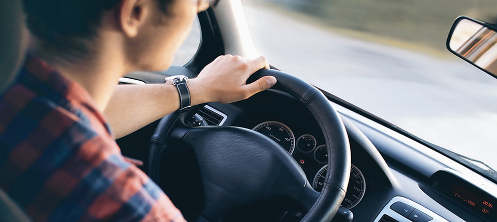 Man Driving in Car