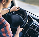 Man Driving in Car