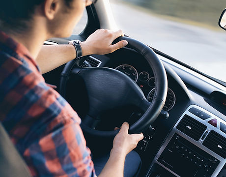 Man Driving in Car
