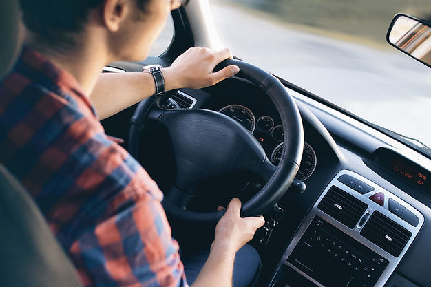 Man Driving in Car