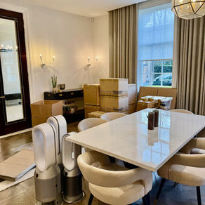 dining room undergoing change, with packed boxes