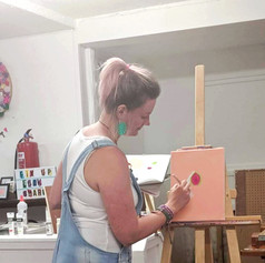 Me stood at the front of the room, teaching, 2019