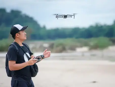 video recording with drone plane asian men using video drones make music videos