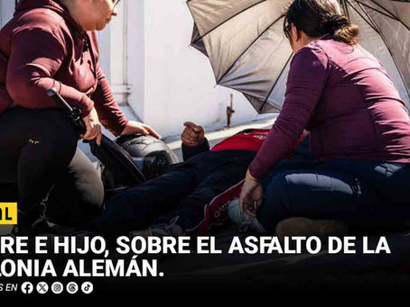 Padre e hijo, sobre el asfalto de la Colonia Alemán