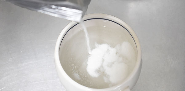 mix coconut powder with hot water