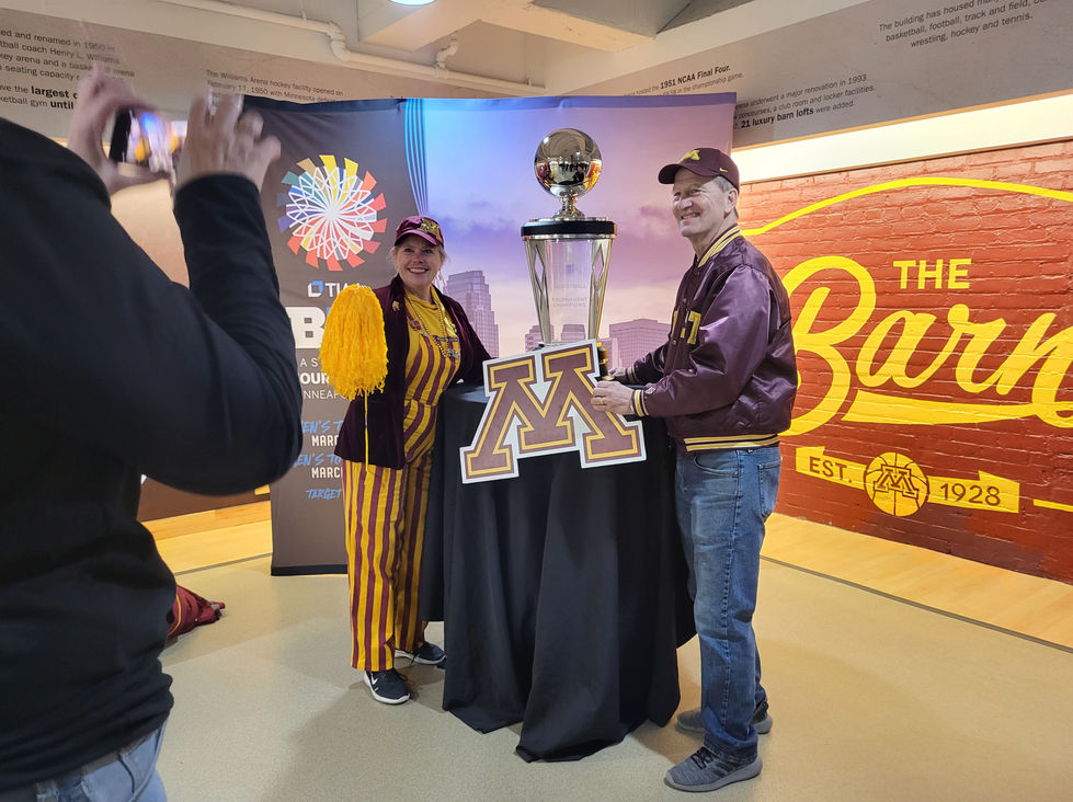 University of Minnesota fans with trophy