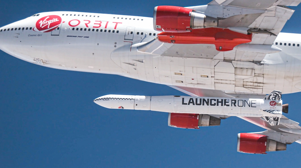 a boeing 747 built for Virgin Orbit with a launcher fixed to the bottom