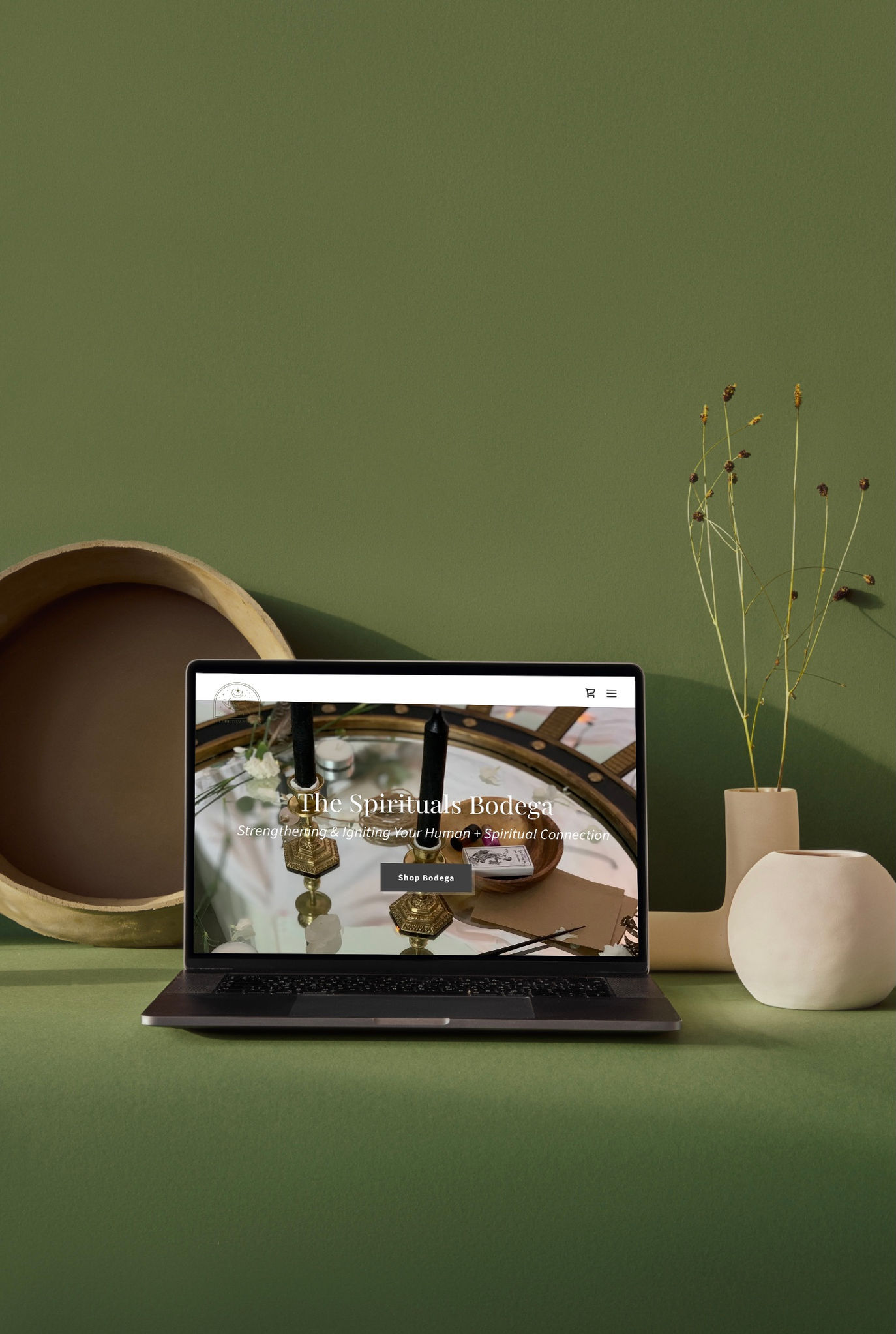 a laptop is open to the website for the spirituals bodega