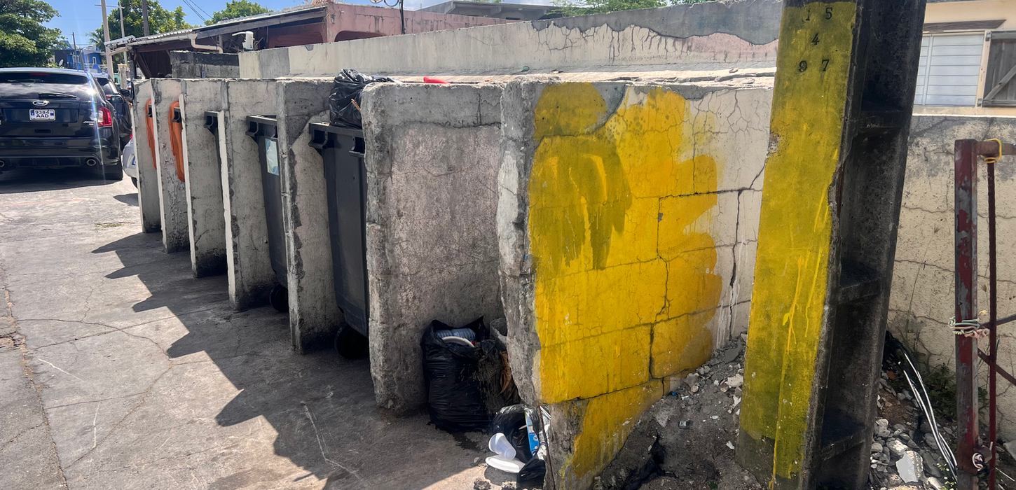 Concrete wall with yellow street art