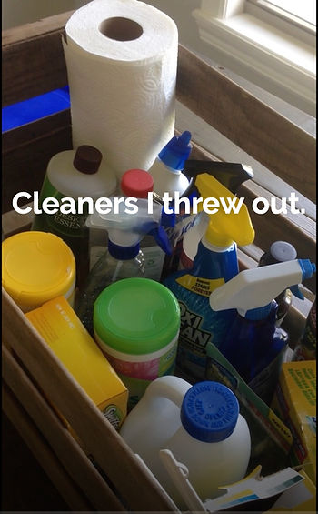 A basket of common home cleaning products that we threw out and replaced with options that won't make us sick.