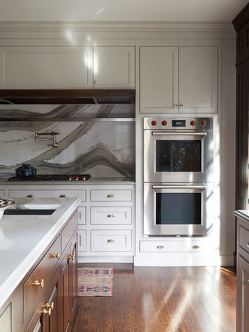 Modern residential kitchen with built-in double ovens.