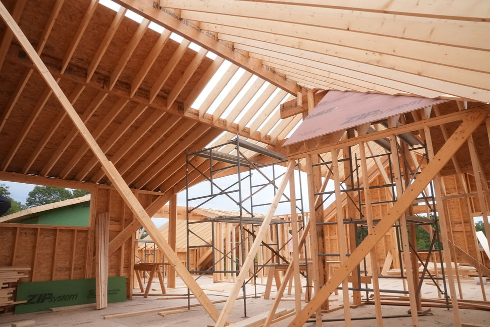 Roof rafters and scaffolding inside the framed home during construction of 39 Mountain Laurel in Tiverton, RI