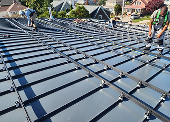 Roof being installed on the custom home at 145 Sauga Ave. during construction in North Kingstown, RI