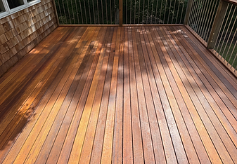 Wood deck restored after pressure washing