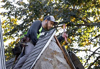 Worker on a rooftop during an active project