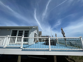 Outdoor deck and pool overlooking the water, built by Figgy's Handyman Service