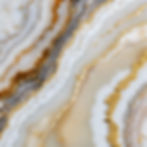 a slice of pearly white agate with small specks of gold.jpg