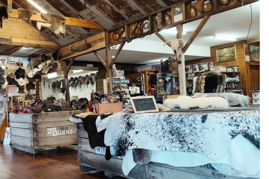 Photo of Simon Martin Whips & Leathercraft store showcasing products like cowhide, whips and other leather goods.