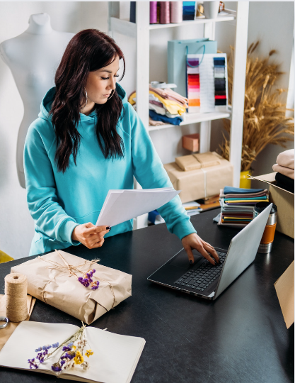 Small business owner processing online orders