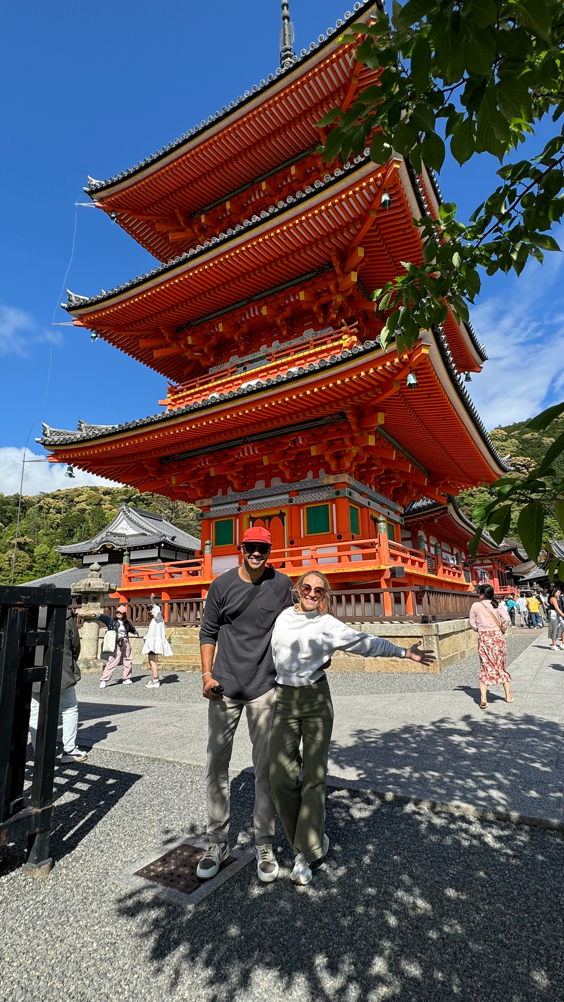 man and woman posed for picture at Kiyomizudera Temple in kyoto japan