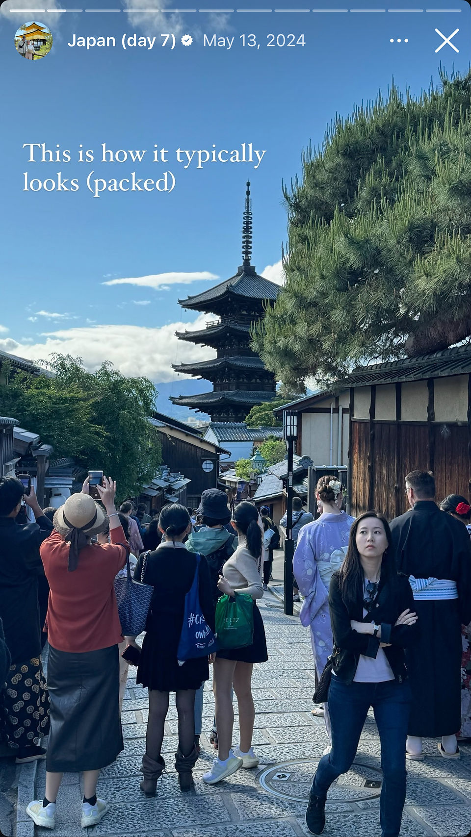 crowd gathered on busy street to capture photos of gion in kyoto japan