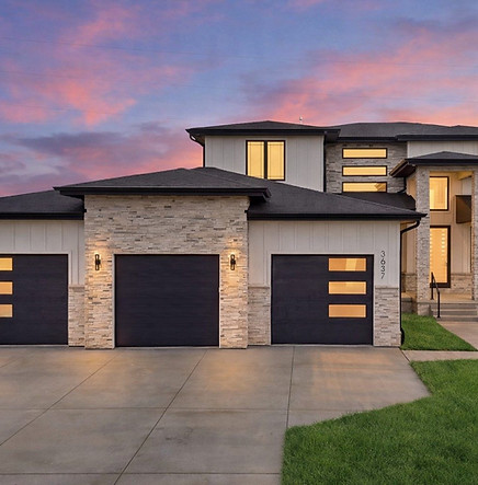 Modern prairie two-story exterior at dusk