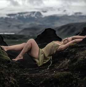 Anastasia Embraces the flowing Shapes and Stacks of a Lava Field