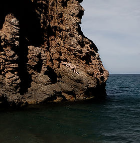 Art nude images on a beach and cliffs in Costa Brava, Spain