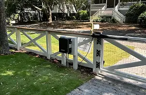 Automatic swing gate with gate operator at a residential entrance