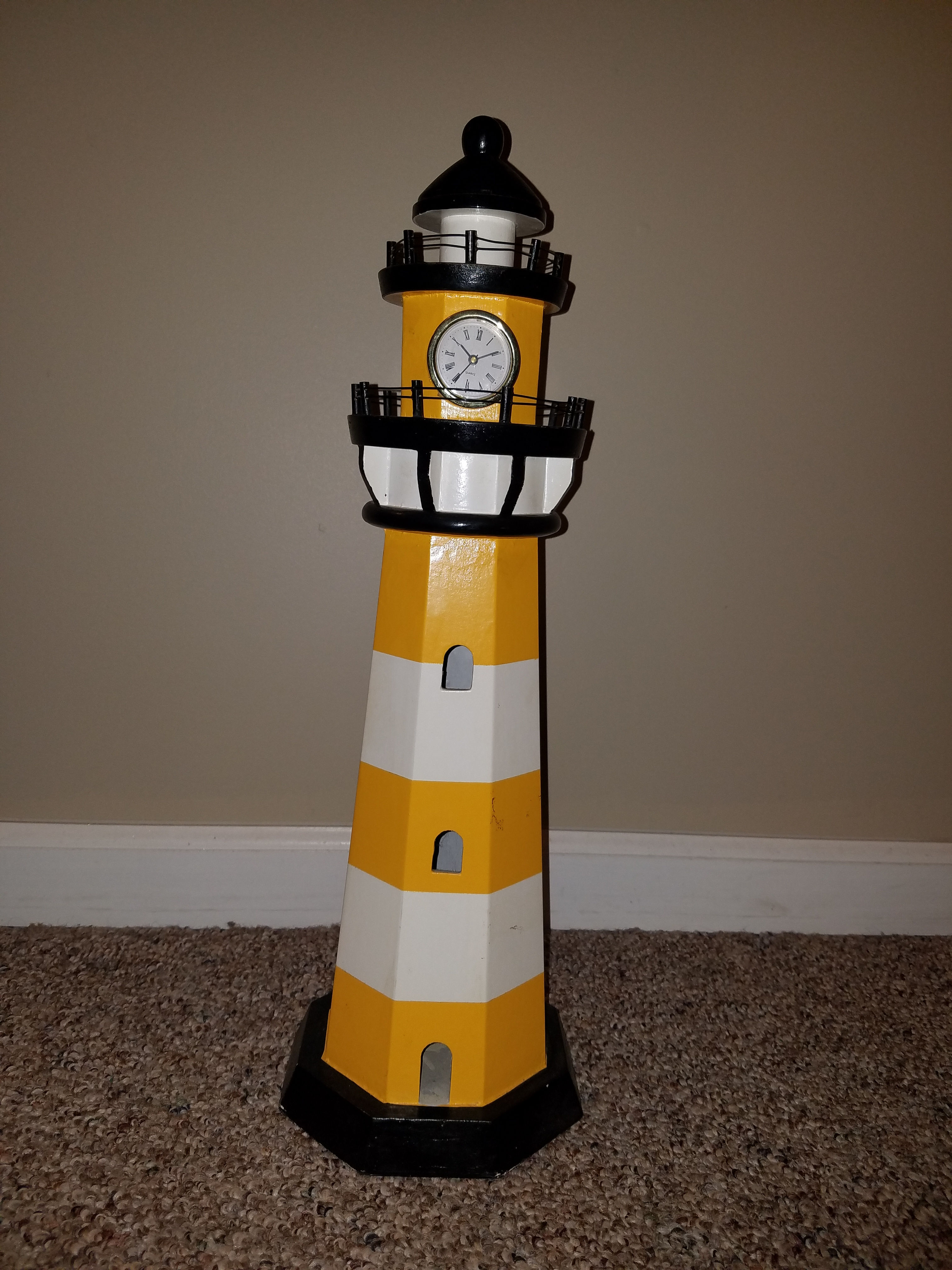 White and Yellow Lighthouse Clock