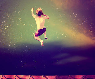 Boy Jumping into Water