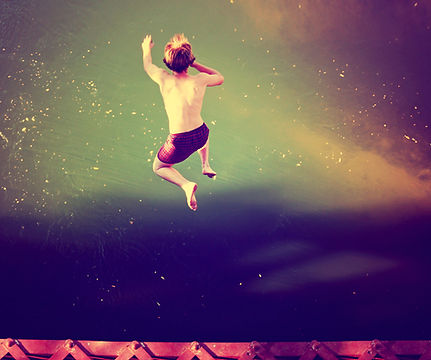 Boy Jumping into Water