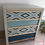 Thumbnail: Bespoke chest of drawers in grey/beige/blue/teal with geometric patterns