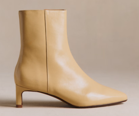 Cream leather boots with a kitten heel