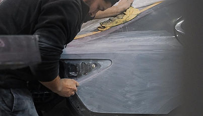 Photograph - Technician performing bodywork on a Quarter Panel