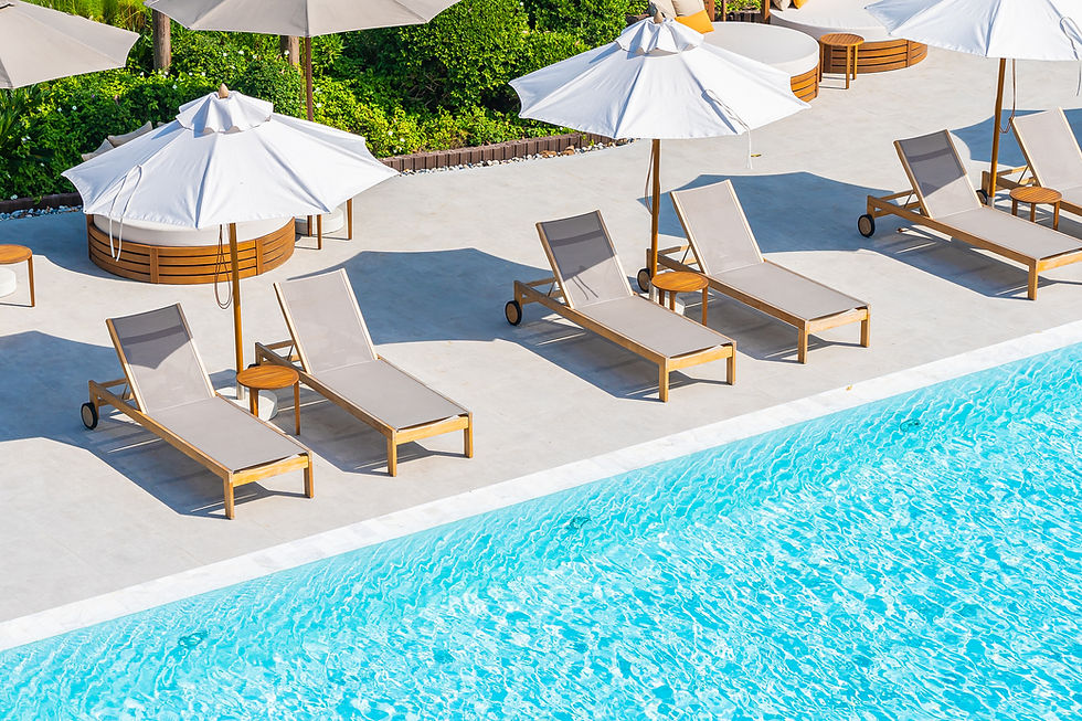 umbrella-deck-chair-around-outdoor-swimming-pool-hotel-resort-nearly-sea-beach-ocean.jpg