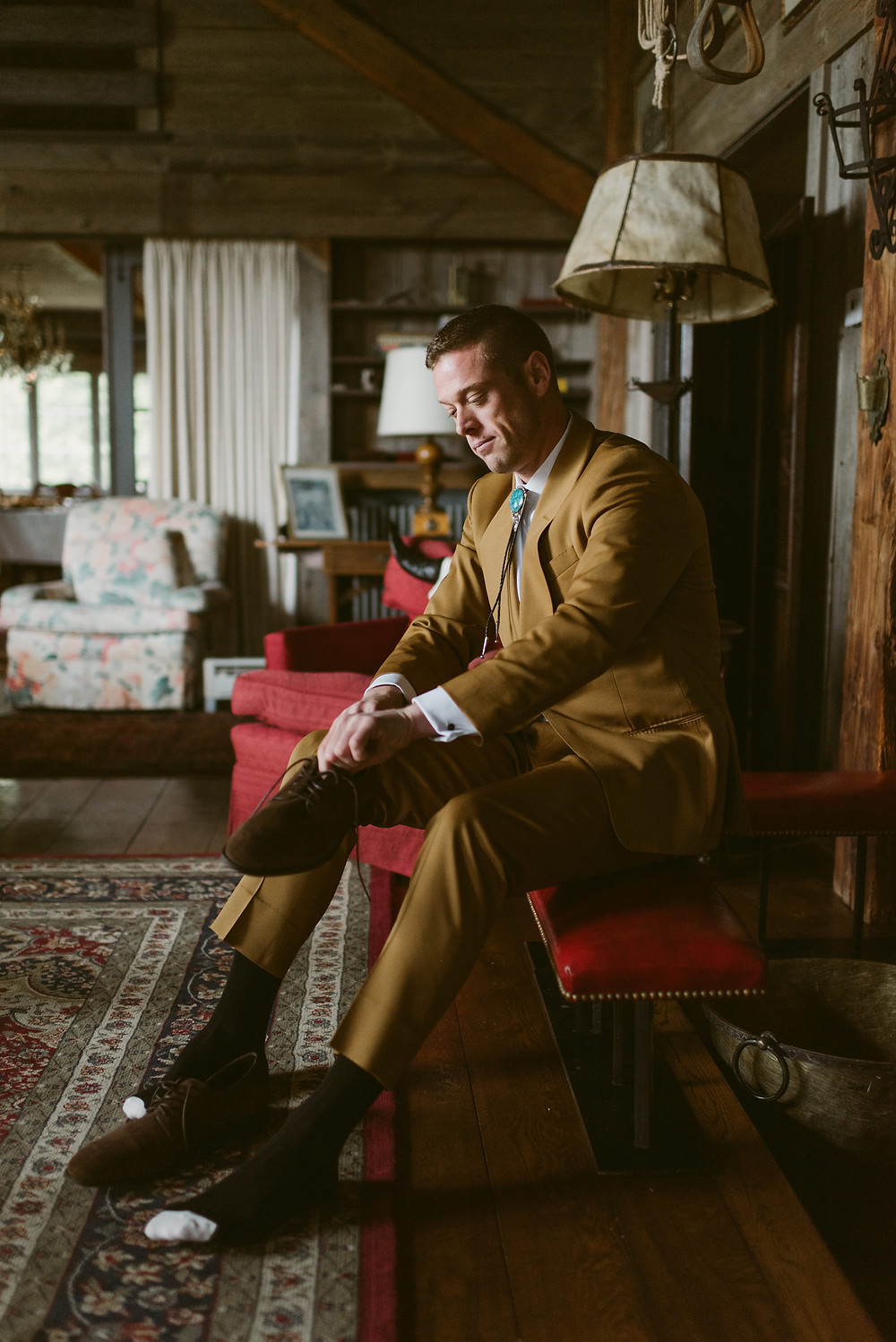 Groom gets ready for his wedding at the River Ranch in upstate New York