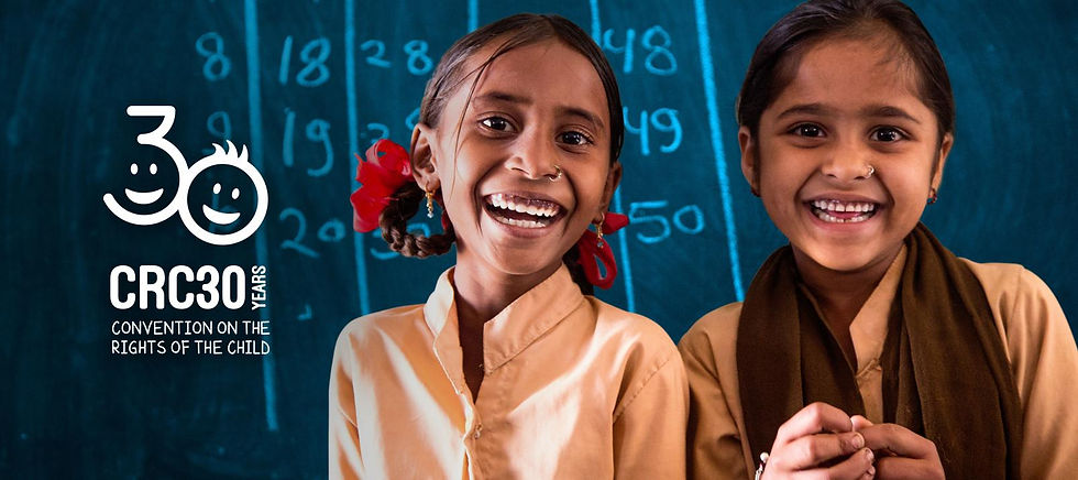 Convention on the Rights of the Child: A 7-year-old student and her best friend stand together in a school classroom in India.