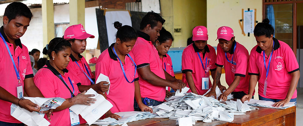 Polling officers tally votes after ballots were cast in Timor-Leste's parliamentary elections (2012).