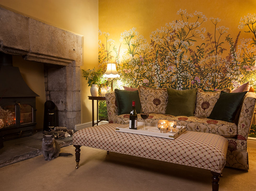 Thumbnail: sofa in evening in front of wild flower wallpaper in yellow