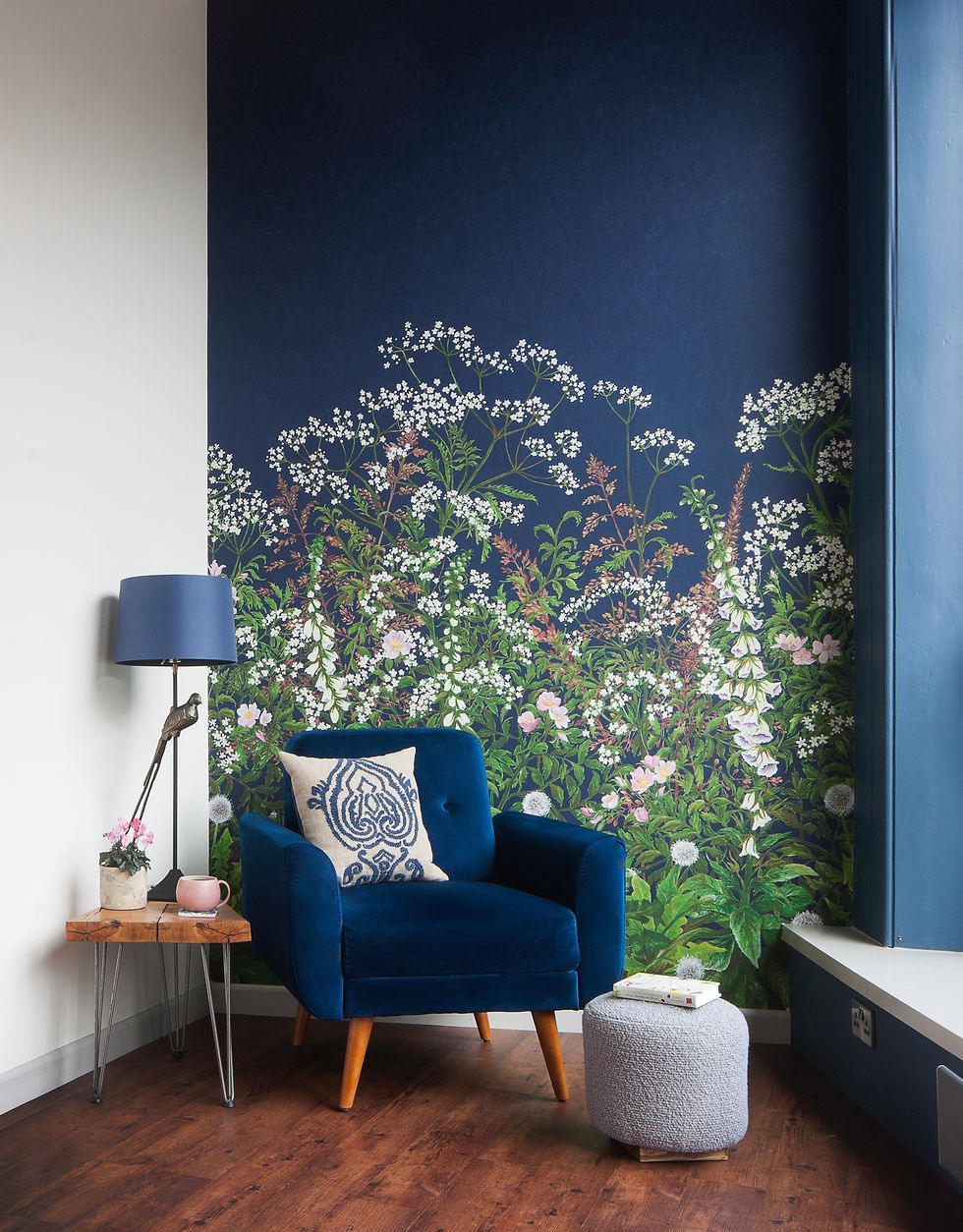 Blue chair in front of wildflower mural navy