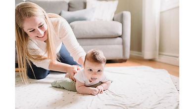 Therapist demonstrating tummy time positioning