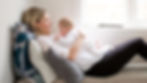 Baby lying on mothers stumach from the side. 
