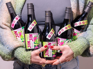 Girl holding lots of bottles