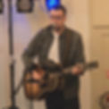 Acoustic wedding music duo performing at outdoor reception
